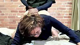 She struggles to talk while getting pounded doggystyle. Backstage, her pierced nipples shine as she screams.