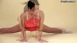 Polina Barna, brunette teen 18+, shows off big saggy tits. She’s flexible during yoga workout.