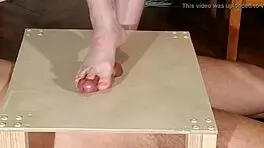 Watch domina stomp cock with bare feet! Footjob madness!