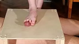 Watch domina stomp cock with bare feet! Footjob madness!