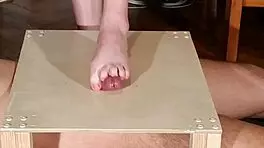 Watch domina stomp cock with bare feet! Footjob madness!
