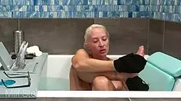 Stella indulges in a soothing bath with intimate shaving rituals