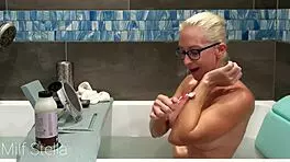 Stella indulges in a soothing bath with intimate shaving rituals