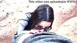she shows her face with glasses, giving a deep blowjob in a beautiful canyon