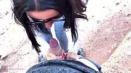 she shows her face with glasses, giving a deep blowjob in a beautiful canyon
