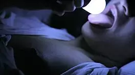 Sleepless girl rubs her trimmed clit under handheld light at night.