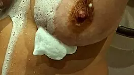 this young MILF with BIG TITS at 18-19 years old shows off her assets in a casual way