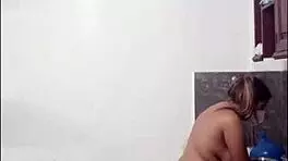 this tall curvy latina is cooking naked in the kitchen looking submissive and cute