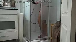 Stepson spies on stepmom’s morning shower, stroking hard.