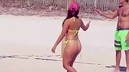 Young girl in micro bikini enjoys beach day with boyfriend's relatives