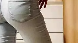 Petite Blonde Performs Seductive Striptease In Tight Jeans