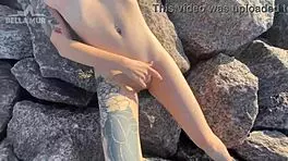 hot exhibitionist teases her clit on a crowded public beach