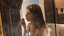 Petite College Cheerleader Removes Panties in Bathroom and Lifts Miniskirt