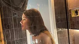 Petite College Cheerleader Removes Panties in Bathroom and Lifts Miniskirt