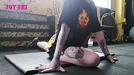 Alternative Girl Stretching At The Gym