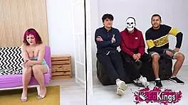 Young Mei, petite with short red hair, instructs three young dudes in a group lesson