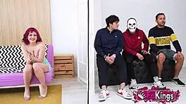 Young Mei, petite with short red hair, instructs three young dudes in a group lesson