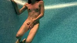 Irina Russaka Bathes Underwater In Pool, Showing Small Tits.