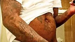 youngstarbrazy is warming up for new content, showing off her tattoo and monster cock