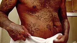 youngstarbrazy is warming up for new content, showing off her tattoo and monster cock