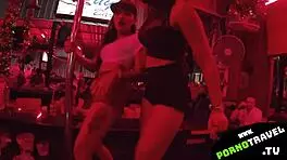 Horny petite 18+ brunette shakes ass at bar in sneakers for group swingers