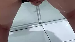 Teen bends over for juicy squirt in bathroom stall