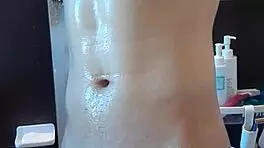 muscular handsome guy masturbates in shower with cum