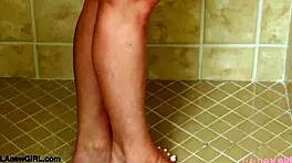 Teen Blonde Model Strips Down for a Steamy Shower in Solo Action.