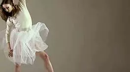 Blonde gymnast just casually showing off moves in a naked workout.