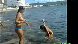 teens show off great tits on the beach