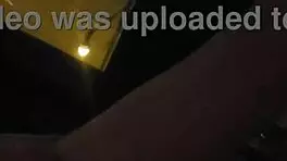 Milf masturbates in front of hotel window.