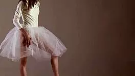 Blonde gymnast just casually showing off moves in a naked workout.