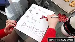 grandpa dressed as santa gives her a present she wont forget