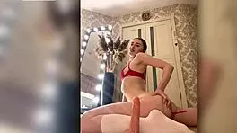 Redhead girl with appetizing forms passionately sucks a huge cock