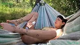 i'm happy satisfiying myself on the hammock outdoors in la mancha spain