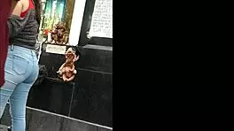 teen latina with tight jeans showing off her curves in a voyeur scene