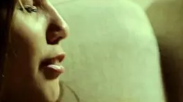 muffling her screams with a ballgag while she dildos her wet pussy!