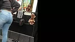 teen latina with tight jeans showing off her curves in a voyeur scene