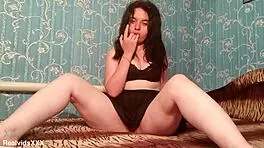 a chubby amateur fingers her shaved pussy and tastes it