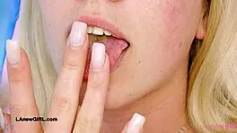 Hey, this fresh-faced blonde model's getting a naked close-up massage on the sofa