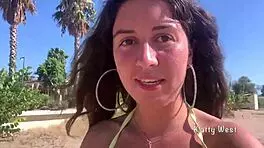 Look at this crazy girl peeing in her panties on the beach!