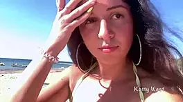 Look at this crazy girl peeing in her panties on the beach!