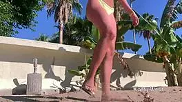 Look at this crazy girl peeing in her panties on the beach!