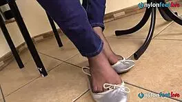 Teen ballerina teases with feet in stockings and pantyhose