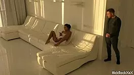 The black asian teen rides the red cock in the white room.