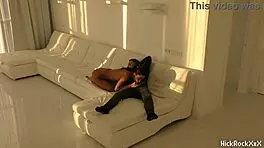 The black asian teen rides the red cock in the white room.