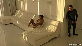 The black asian teen rides the red cock in the white room.