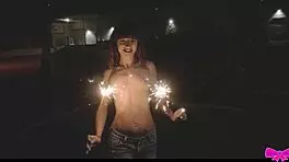 Just chilling topless outdoors with Honey Gold and Dakota Marr flashing sparklers.