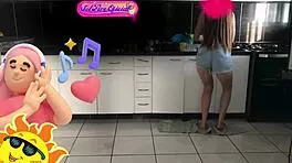 Sol tidies the kitchen