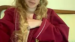 Why does this cute natural blonde in pajamas touch her big tits before studying outdoors?